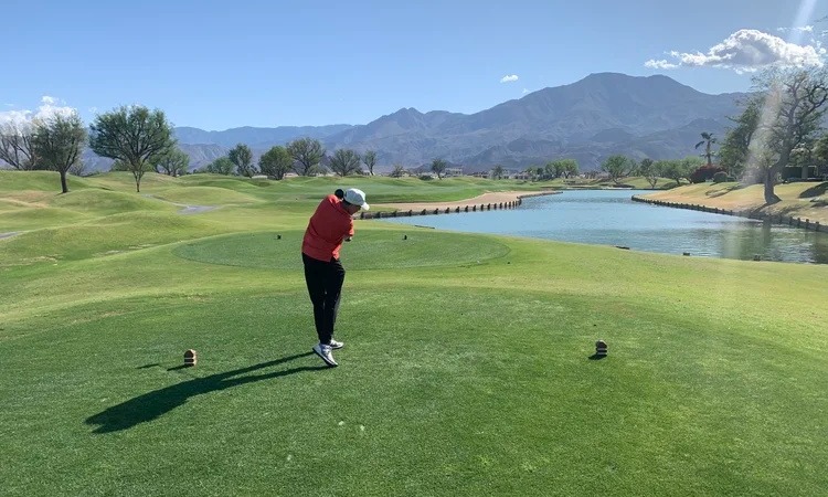Brian Mulligan teeing off on a golf course